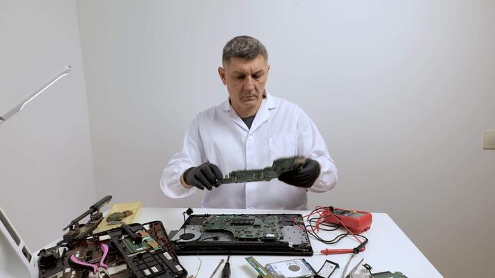 Engineer examining laptop